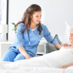 Medical worker with senior woman in nursing home